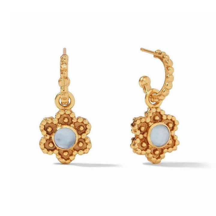 Gold hoop earrings with delicate floral accents and light blue stone details.