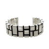 Contemporary sterling silver cuff bracelet with geometric block design.