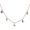 Rose gold Cosmic Energy Field necklace with heart, hamsa, evil eye, and star charms, each adorned with a sparkling diamond.