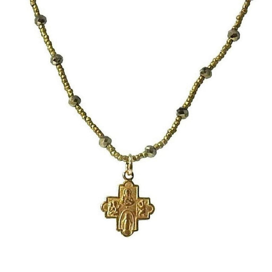 Gold cross necklace with pyrite and Heishi beads.