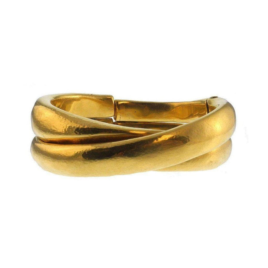 Gold Crossed Cuffs bracelet, textured finish, elegant design.