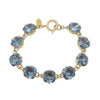 Montana Cushion Cut Tennis Bracelet: Gold chain, light blue crystals.