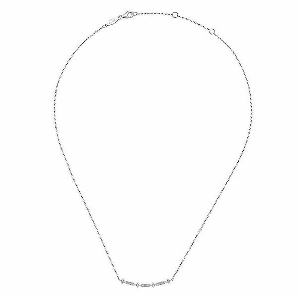 Dainty diamond bar necklace on a delicate chain.