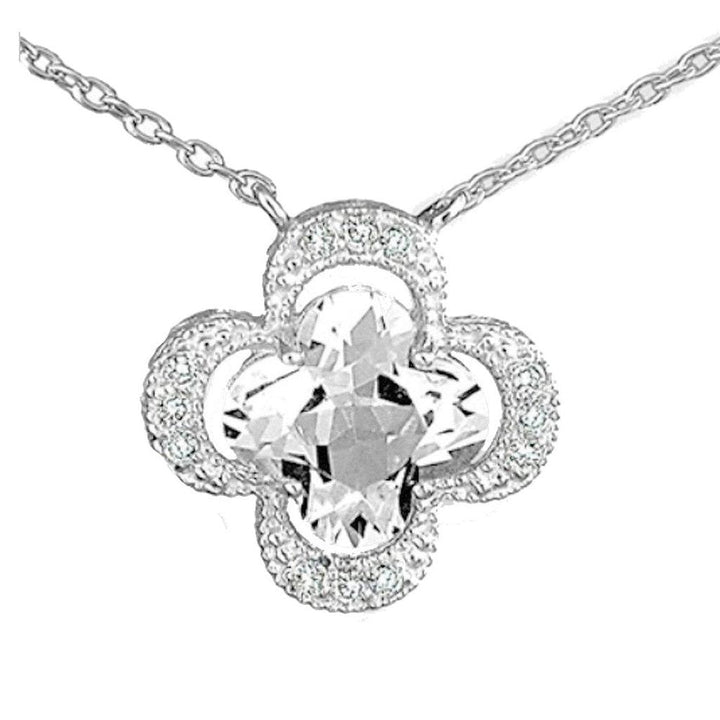 14k white gold clover pendant featuring a large white topaz and diamond accents.