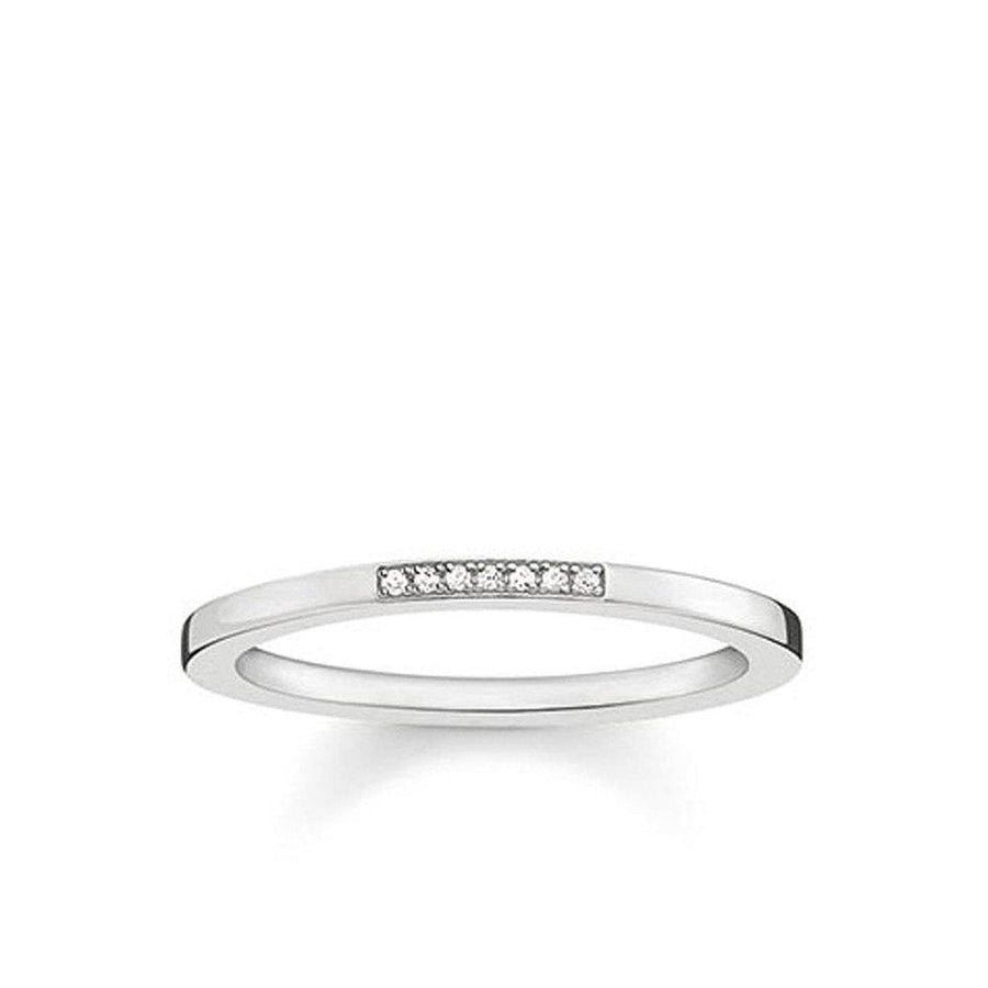 Silver diamond band ring with seven small diamonds.