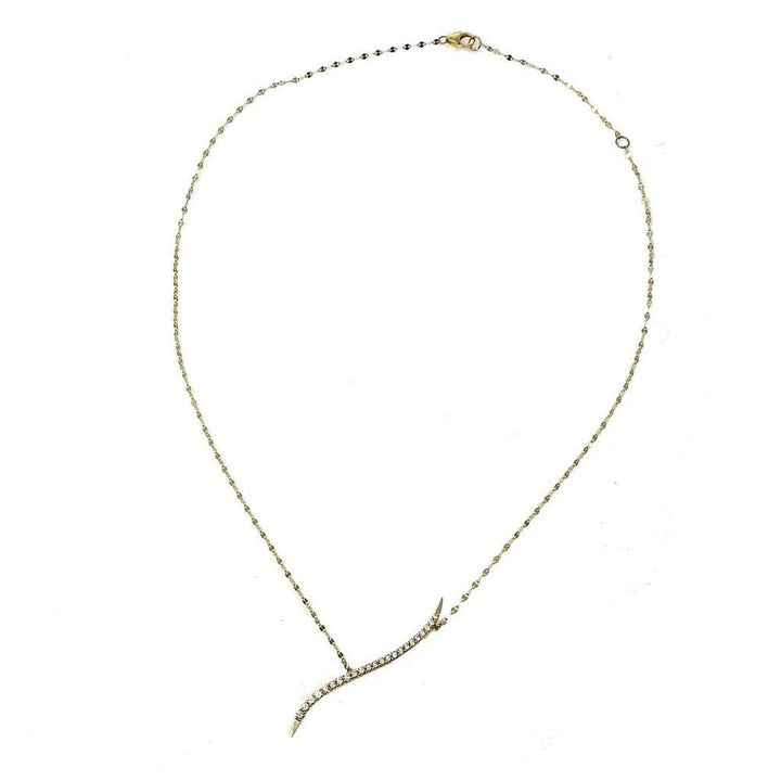 Dainty gold chain necklace featuring a curved diamond pendant.