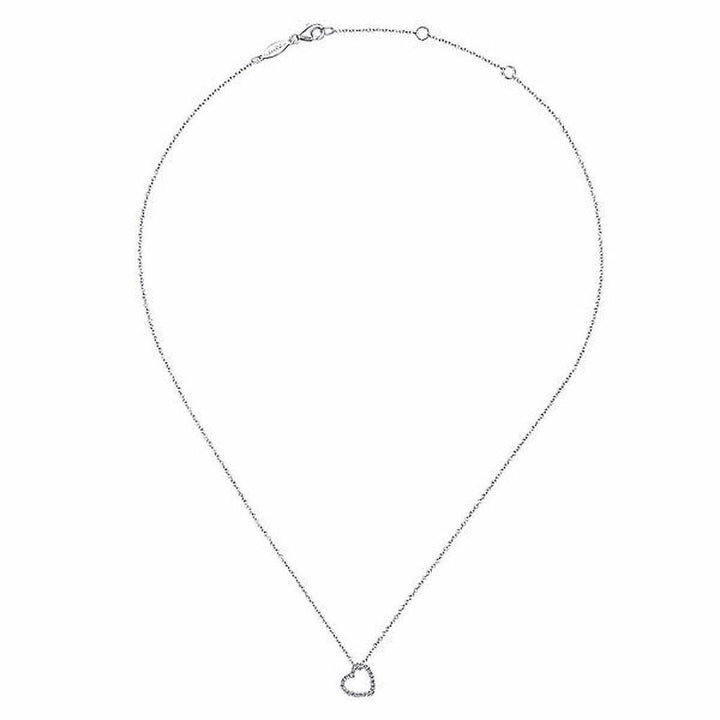 Dainty silver chain necklace with a small diamond heart pendant.