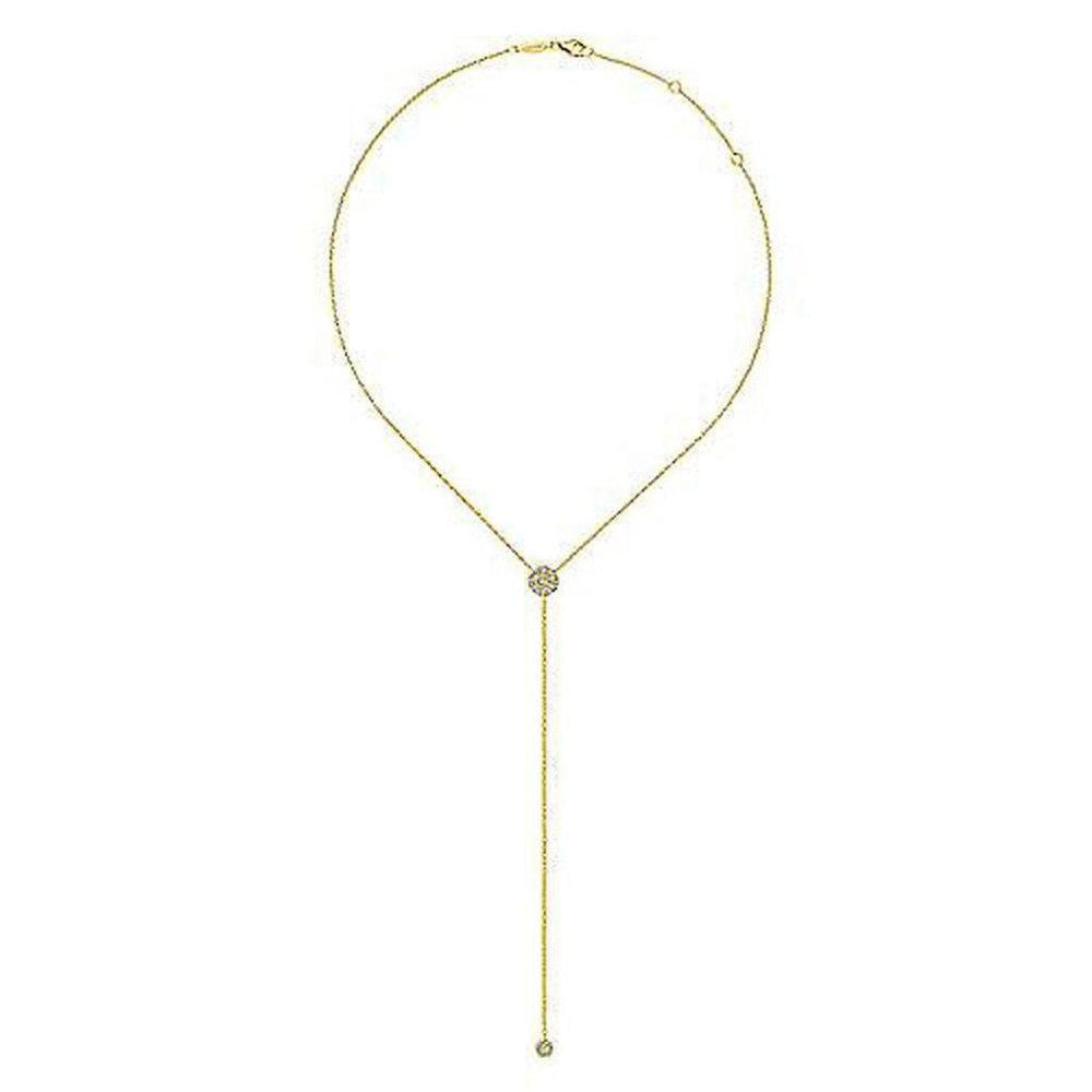 Long gold lariat necklace featuring a diamond-encrusted pendant.