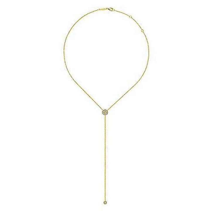 Long gold lariat necklace featuring a diamond-encrusted pendant.