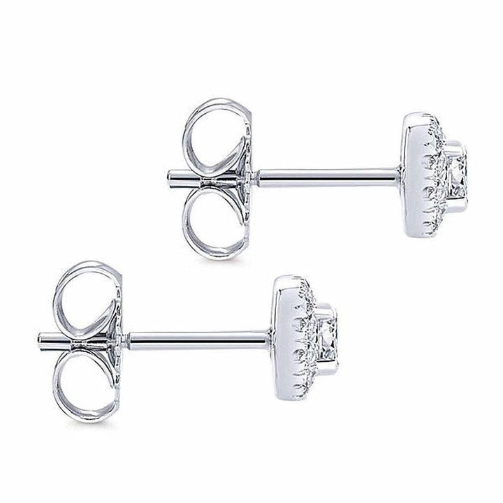 Elegant diamond stud earrings with halo setting, shown from two angles.