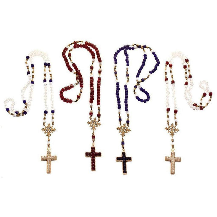 Four beaded rosaries with ornate crosses; red, white, blue, and clear glass beads.