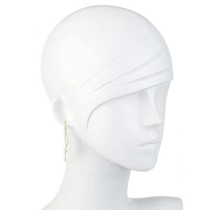 Gold long chain earrings on a white mannequin, showcasing delicate design.