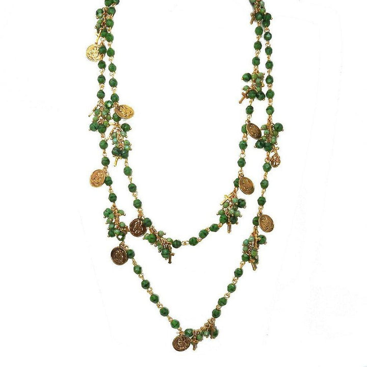 Double-strand green bead necklace with gold charms and crosses.