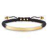 Engravable macrame bracelet with gold plate and skull accents.