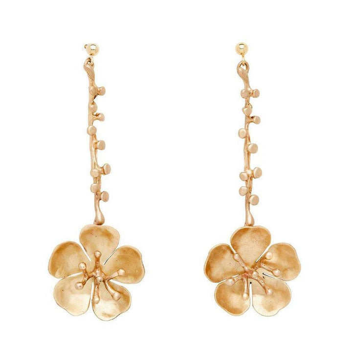 Eve Cherry Blossom gold drop earrings, featuring delicate flower and stem design.