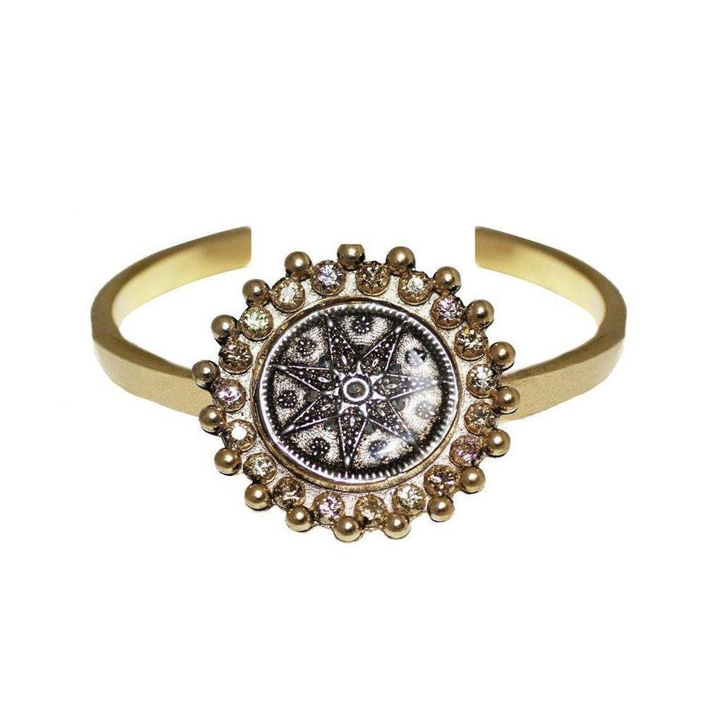 Gold Fay Cuff bracelet with a starburst medallion and sparkling diamonds.