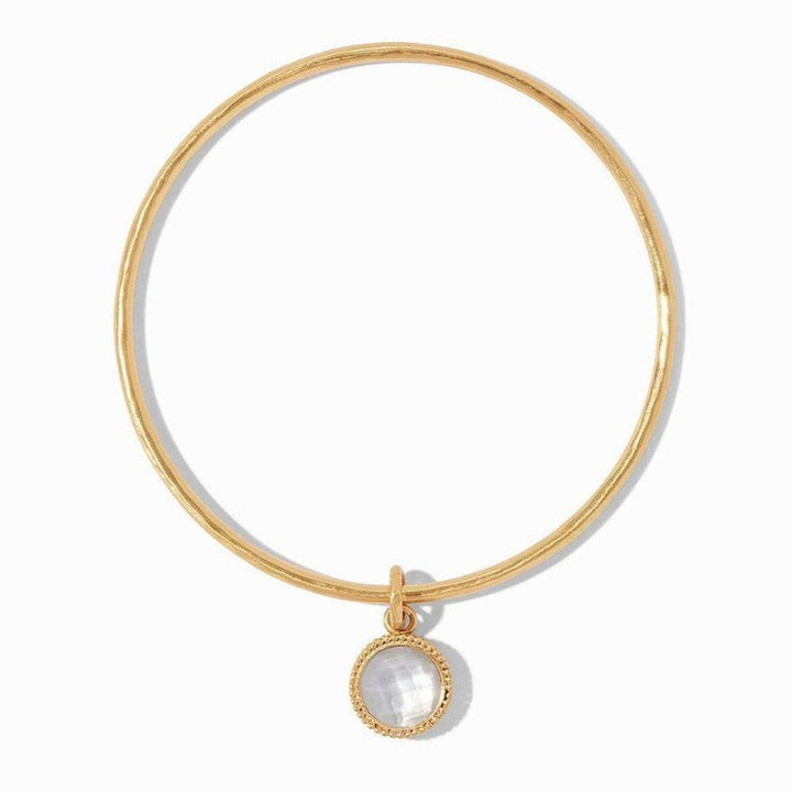 Gold bangle bracelet with a delicate, faceted opal charm.