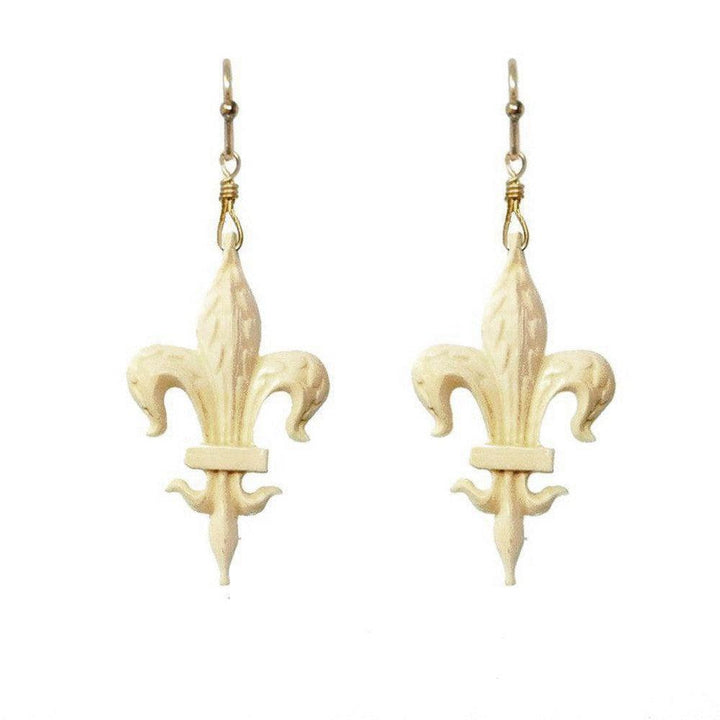 Cream-colored Fleur de Lis earrings with gold-tone hooks.