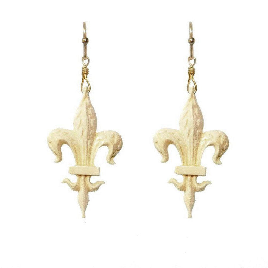 Cream-colored Fleur de Lis earrings with gold-tone hooks.