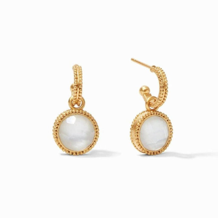Gold hoop earrings with delicate beaded detailing and a white stone charm.