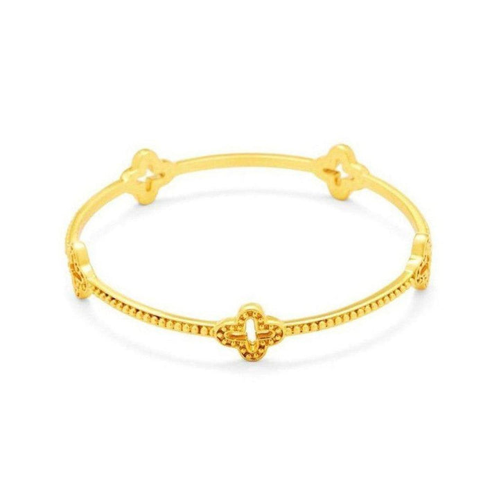 Gold Florentine bangle bracelet with textured detailing and four clover accents.