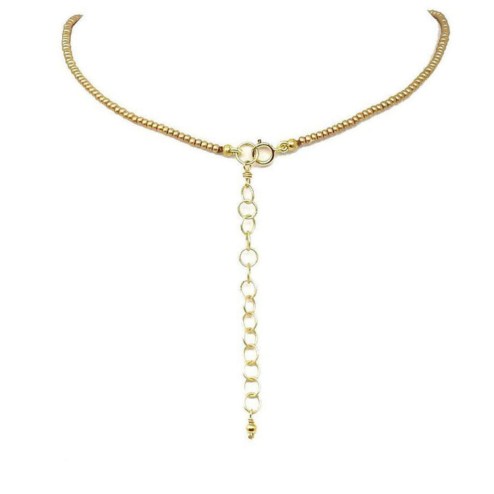 Gold beaded necklace back view, showing clasp and extender chain.