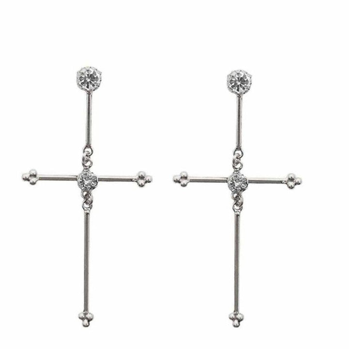 Silver cross earrings with sparkling accents.