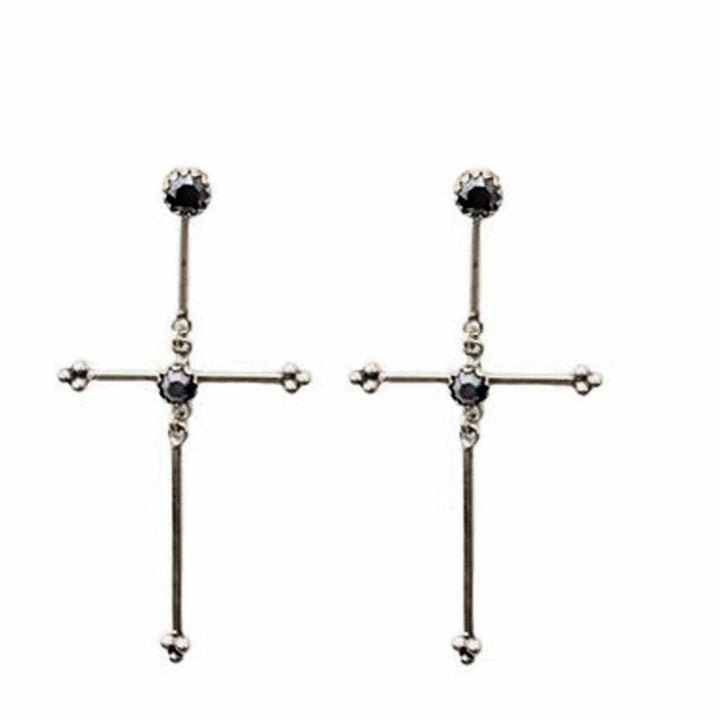 Silver cross earrings with dark gray stones.