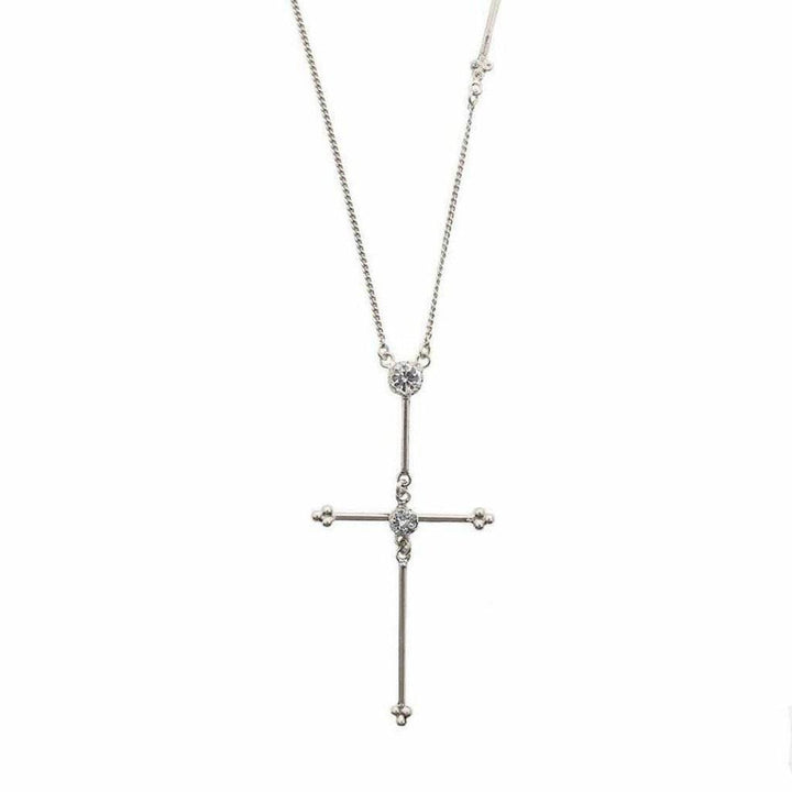 Silver cross necklace with cubic zirconia accents on a delicate chain.