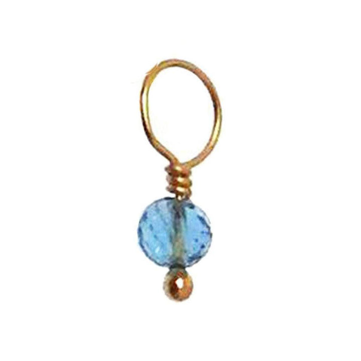Gold-wrapped blue gemstone charm with a small gold bead accent.