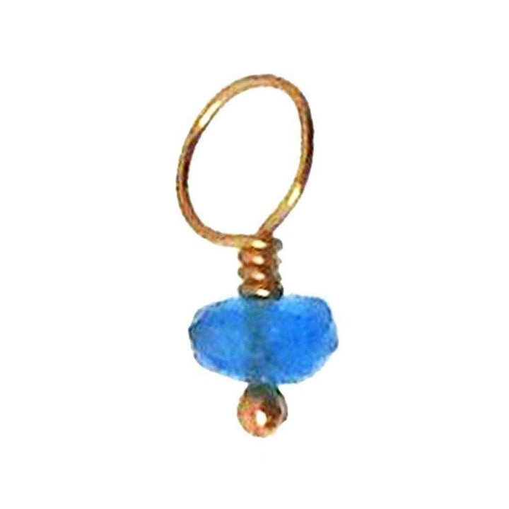 Blue gemstone charm with gold wire accents
