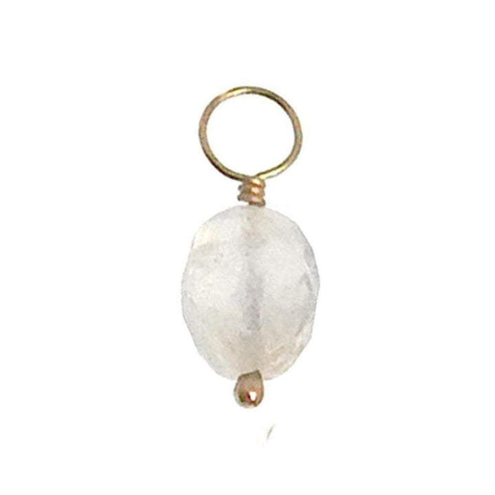 White gemstone charm with gold wire and loop for jewelry making.