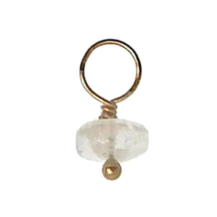 Gold-wrapped gemstone accent with a milky white stone.