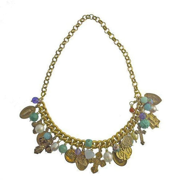 Gold chain necklace adorned with colorful stones and charm pendants.