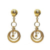 Gold link chandelier clip earrings with textured ball tops and layered circle accents.