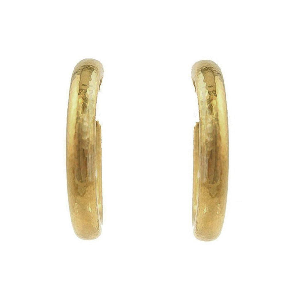 Gold oval hoop earrings with a hammered texture.