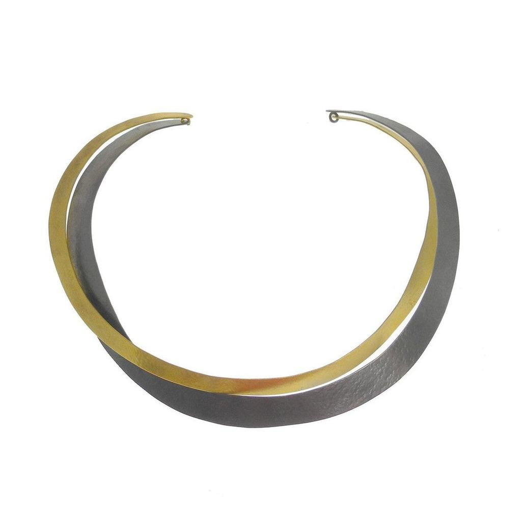 Gold and rhodium twisted collar necklace, modern design.