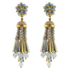 Grey beaded tassel clip earrings with iridescent accents and gold detailing.