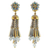 Grey beaded tassel clip earrings with iridescent accents and gold detailing.