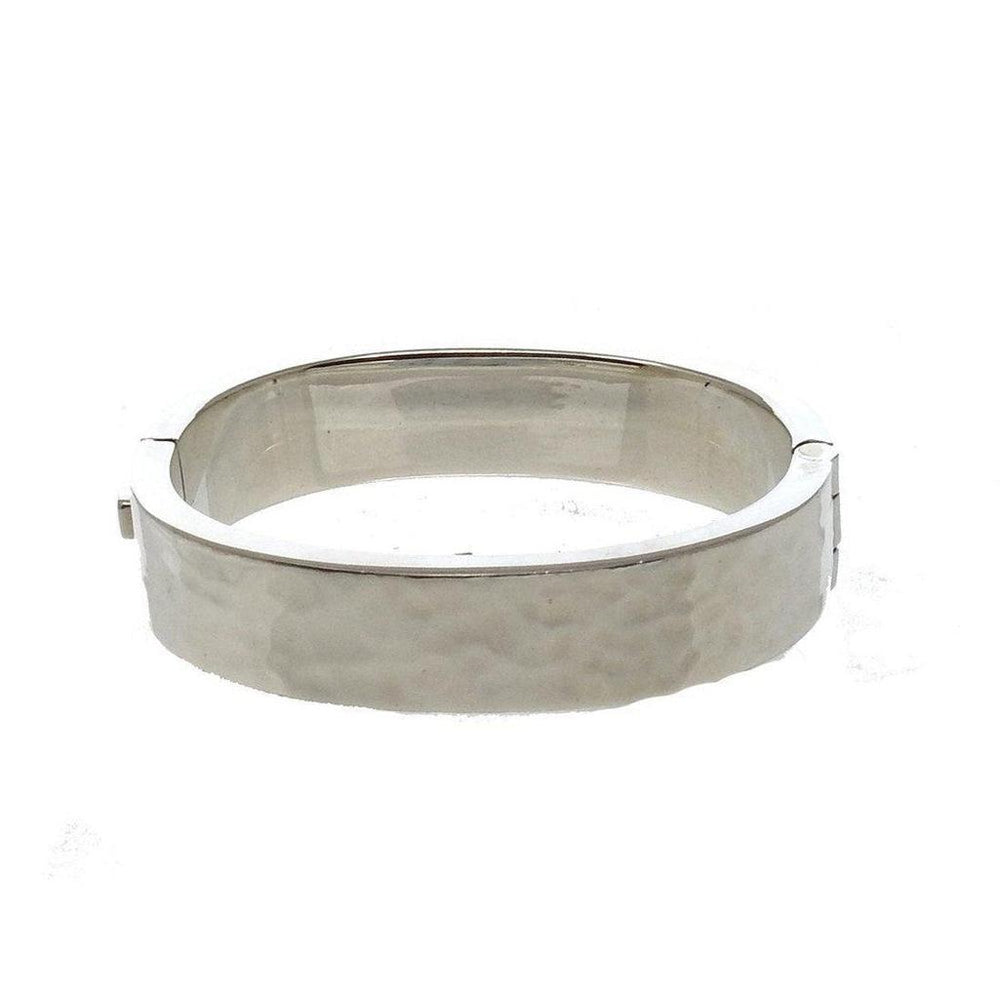 Silver hinged bangle bracelet with hammered texture.