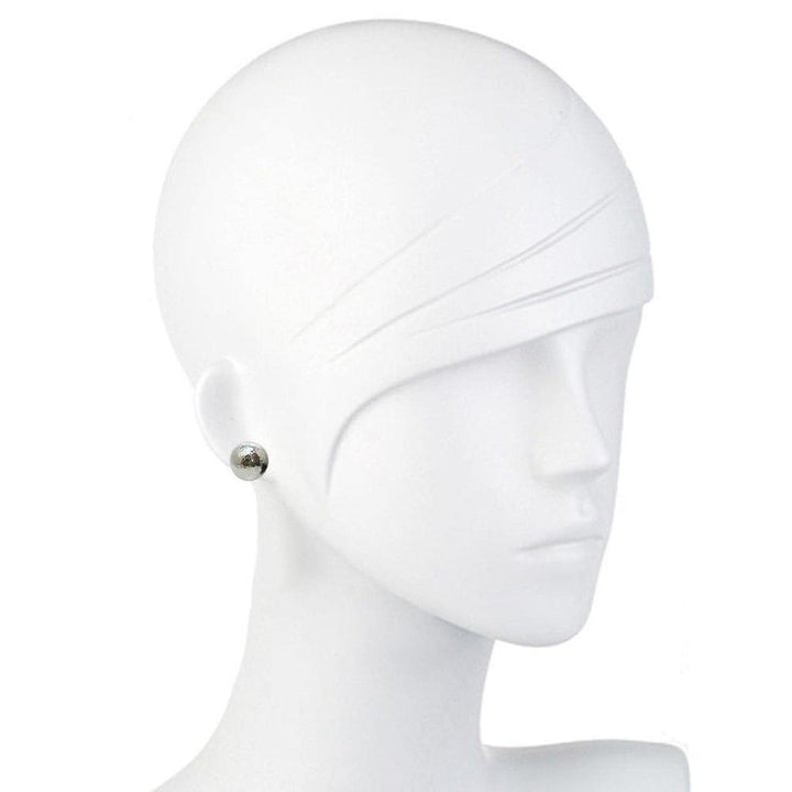 Silver hammered ball stud earrings on a mannequin.