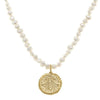Handcast gold bee pearl necklace featuring a textured gold bee charm.