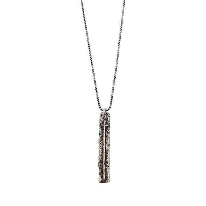Silver cross pendant necklace with textured rectangular charm.