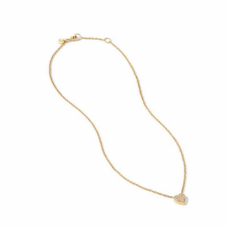 Gold chain necklace with small, sparkling heart pendant.
