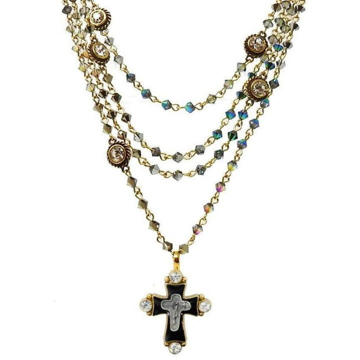 Hombre Bicone Magdalena necklace: multi-strand gold chain with iridescent crystals & black cross pendant.