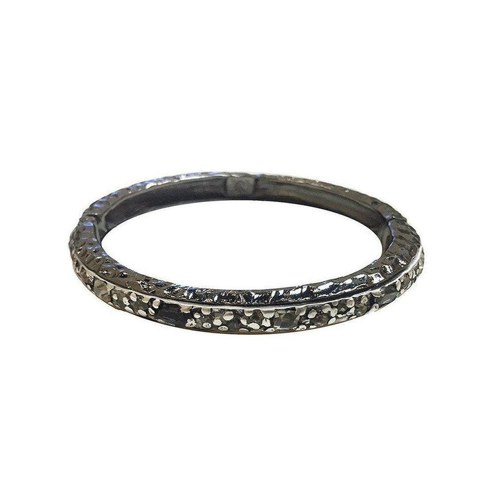 Gunmetal hinged bangle bracelet with textured finish and sparkling accents.