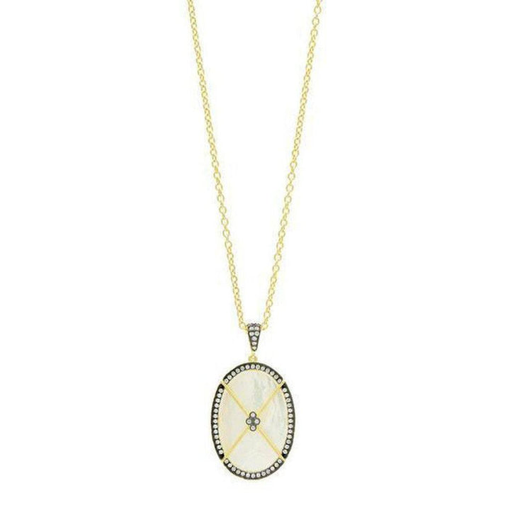Oval mother-of-pearl pendant necklace with gold chain and diamond accents.