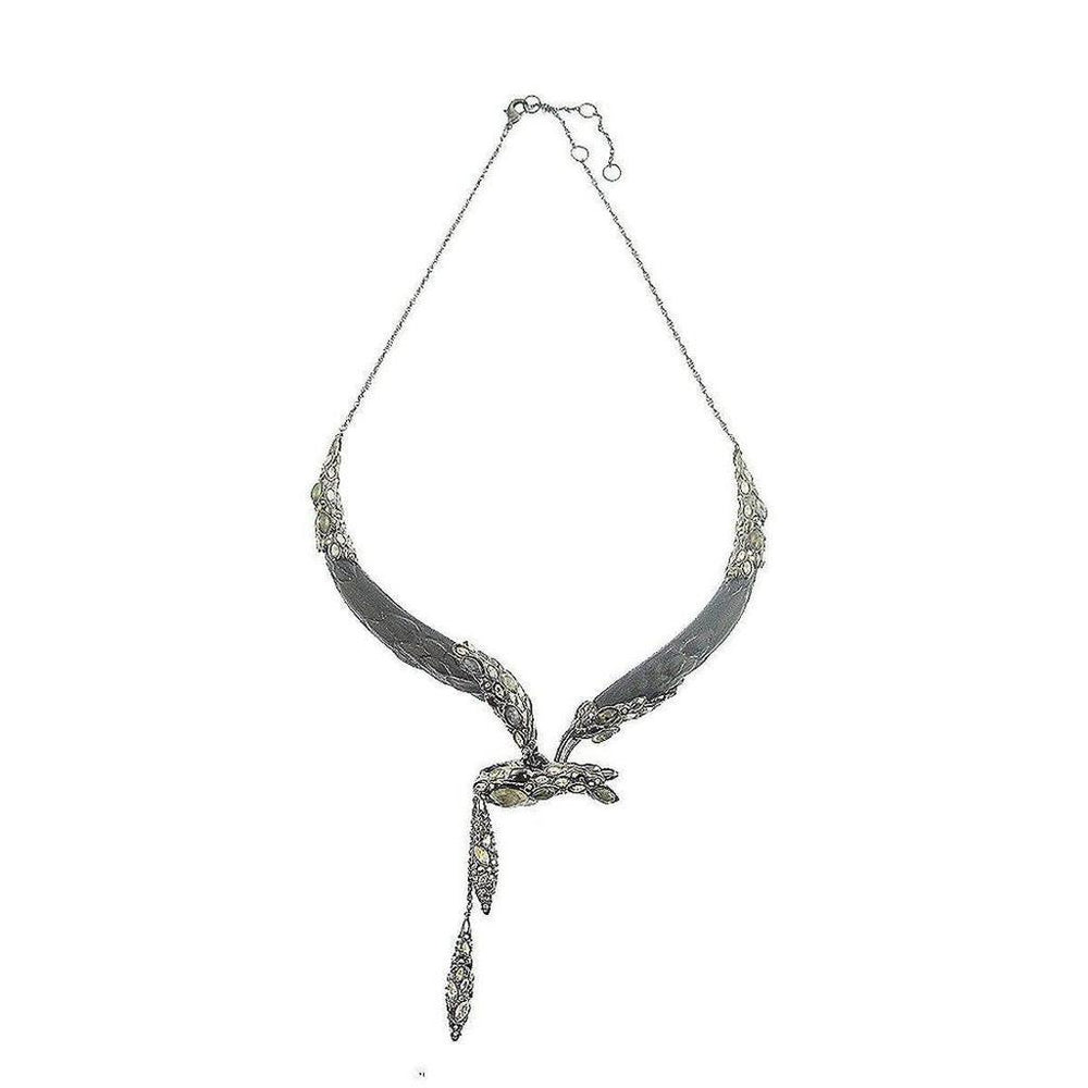 Elegant dark gray snake-form necklace with shimmering gemstone accents.