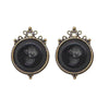 Jet Round Intaglio clip earrings with antique brass finish and pearl accents.