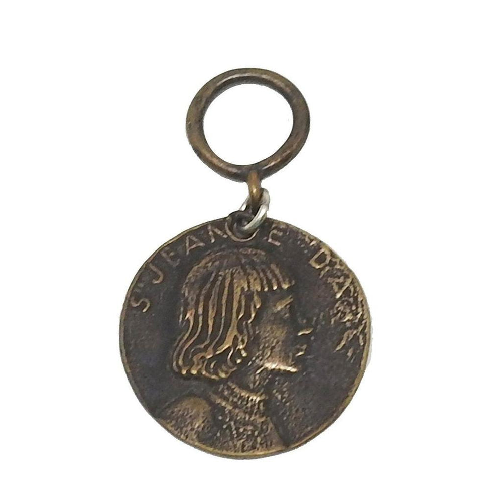 Bronze medallion featuring Joan of Arc profile.